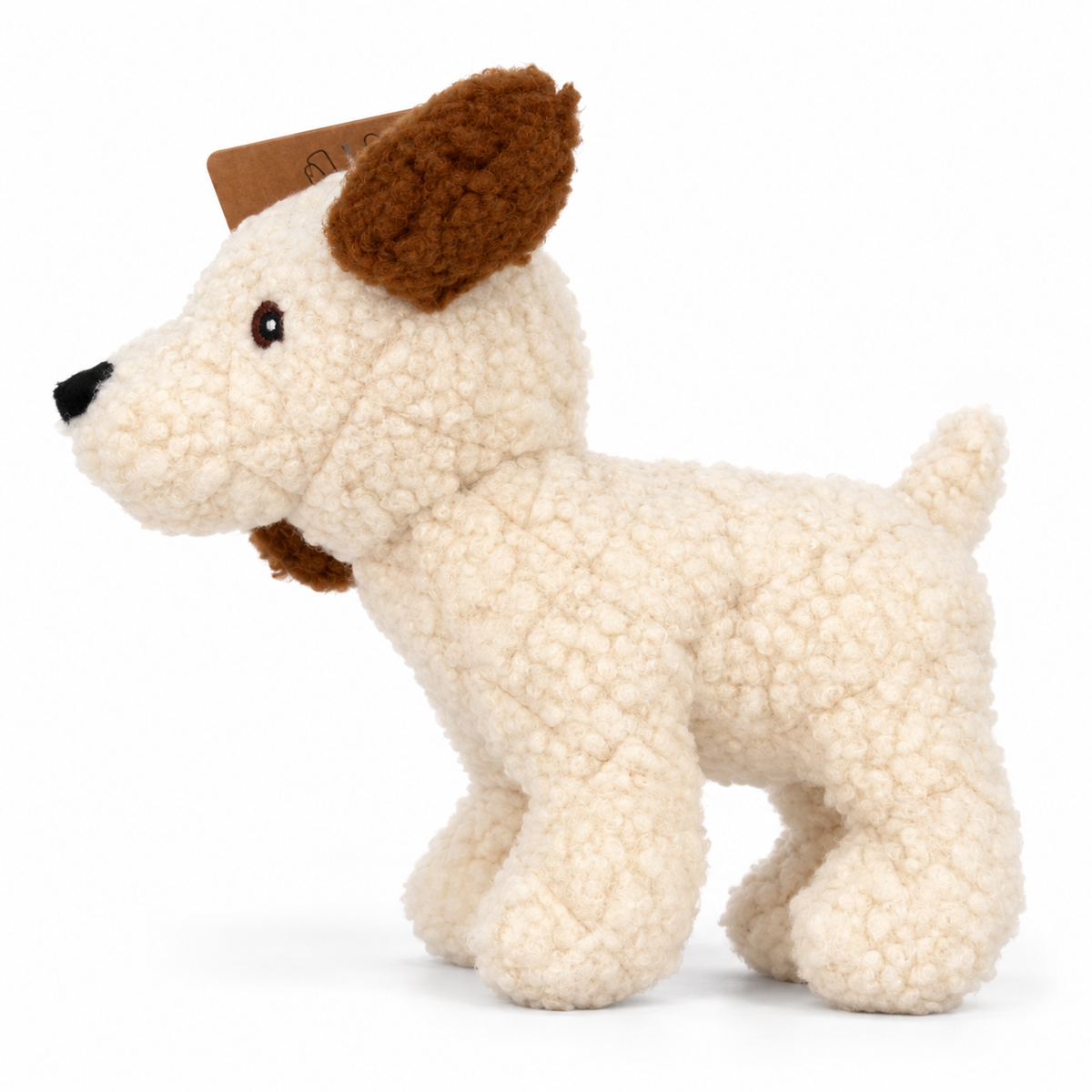 Cream curly plush dog toy side view