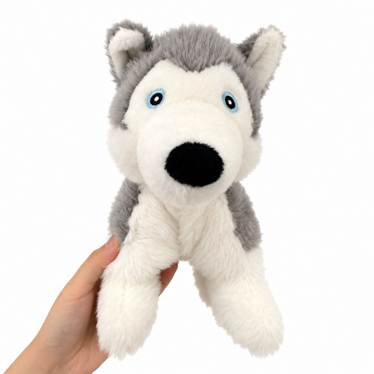 Hudson husky plush dog toy held in hand