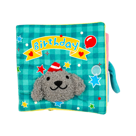 Joopy & Co blue birthday-themed fabric snuffle book for dogs with a grey plush dog wearing a party hat on the cover