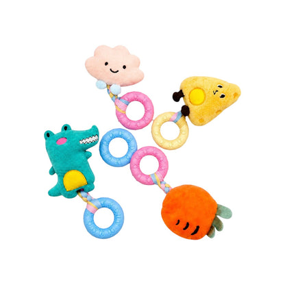 Joopy & Co 4-pack plush dog toys featuring a cheese, carrot, cloud, and dinosaur, each with a textured TPR chew ring.