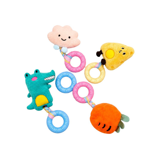 Joopy & Co 4-pack plush dog toys featuring a cheese, carrot, cloud, and dinosaur, each with a textured TPR chew ring.